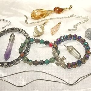 Bundle of crystal pendants, jewelry, bracelets, & chains. Amethyst. Amber.